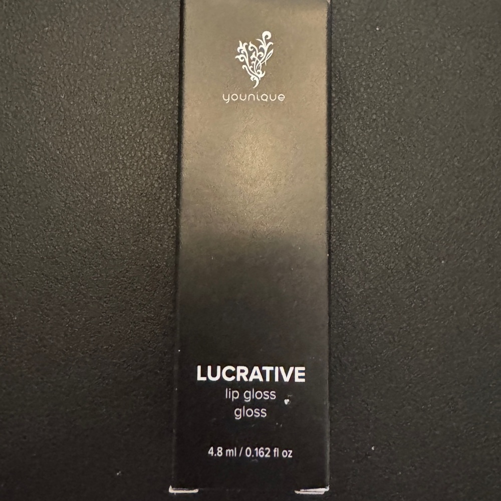 Younique Lighthearted Lip Gloss in Black Packaging